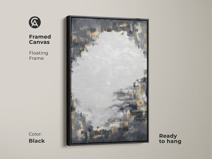 Framed canvas showcases charcoal grey and gold abstract artwork with a black floating frame. Ready to hang it offers a sophisticated accent. The modern abstract painting enhances any living room or office. Its neutral palette with metallic touches complements various decor styles.