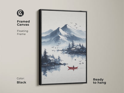Black framed canvas print of an ink wash mountain lake with a red boat. This Scandinavian landscape art adds a touch of peace to any room. The blue and white tones create a serene atmosphere. It's ready to hang and perfect for residential wall decor.