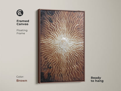 Bronze gold spiral artwork in a brown floating frame. This framed canvas features an abstract sunburst print. The textured eclectic artwork adds a modern touch. It is ready to hang and is a great housewarming gift.