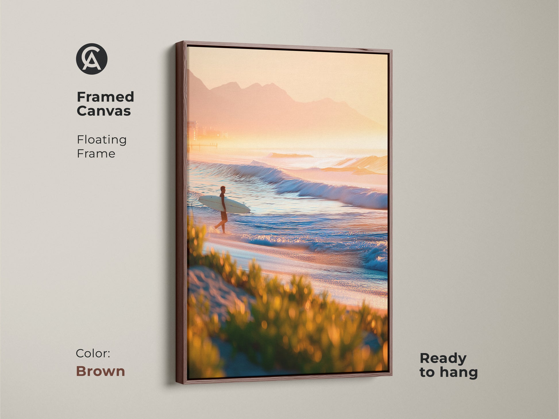 Framed canvas art in a brown frame. The artwork features a surfer walking along the beach at sunrise. Floating frame adds depth. Ready to hang. Add warmth to your decor with this brown framed canvas.