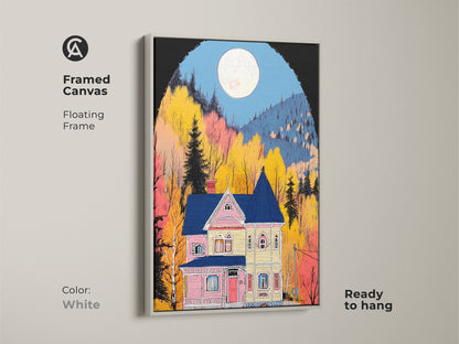 Framed canvas art displaying a Victorian house under a full moon. This folk art print features a floating white frame adding a bright touch. Ready to hang this artwork creates a cozy eclectic home environment.