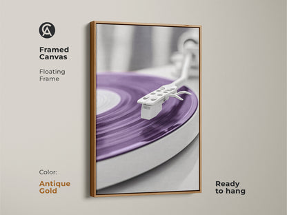 Antique gold framed canvas print of a purple vinyl record player. A minimalist mid-century modern artwork suitable for retro music room decor. Perfect for adding a unique touch to any home office. A stylish gift for music enthusiasts. Ready to hang and enjoy.