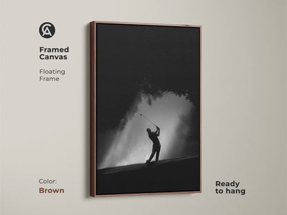 Elevate your space with this framed golf canvas. The brown floating frame enhances the black and white artwork. The golfer is captured in a dynamic swing. Ready to hang and instantly enjoy.