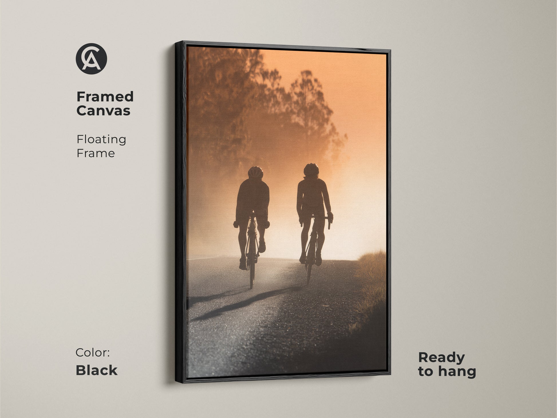 Framed canvas art featuring a cycling couple silhouette. The modern road artwork has a floating black frame and is ready to hang. Perfect modern entryway home decor or a unique gift for cyclists. Captures a sense of journey and shared experience.