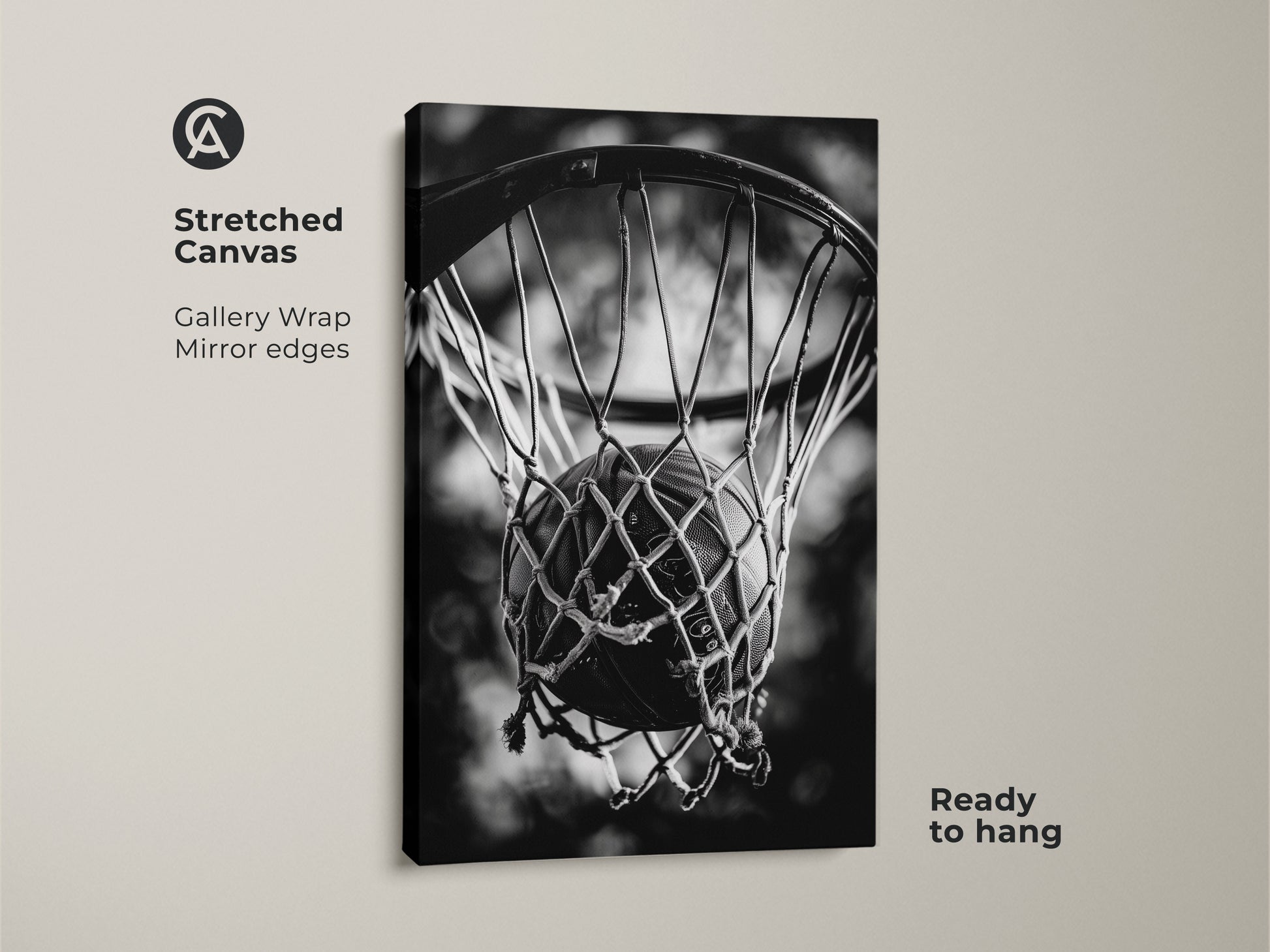 Stretched canvas basketball artwork. This gallery-wrapped canvas features mirror edges. The black and white sports art shows a basketball in a net. The canvas is ready to hang. Add a modern touch to your home decor with this piece.