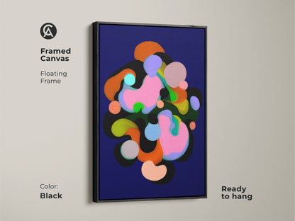 Framed canvas with a floating frame in black showcasing abstract art. The modern artwork features geometric shapes in colors like indigo pink and green. Ready to hang this contemporary print adds a touch of sophistication to any room's wall decor.