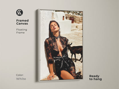 Framed canvas of a glamorous woman in black lace with a white frame. The fashion editorial artwork showcases a goat. The unique home gift is ready to hang. The black white beige art enhances modern eclectic art collections. Add sophisticated style.