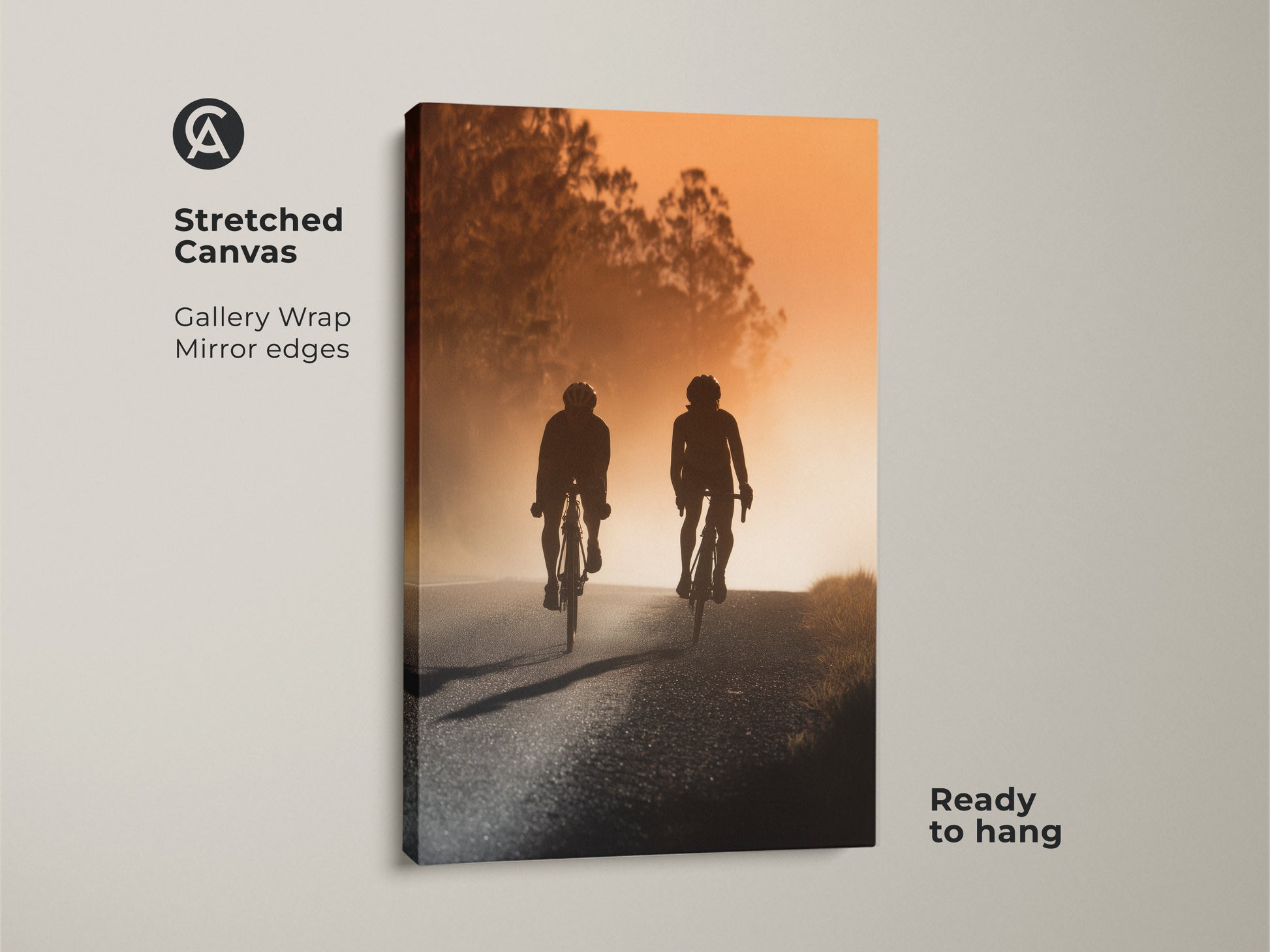 Stretched canvas print featuring a cycling couple silhouette. Gallery wrapped with mirrored edges and ready to hang. This modern landscape canvas artwork captures a sense of adventure. Ideal as entryway home decor. A unique housewarming gift for a cyclist.