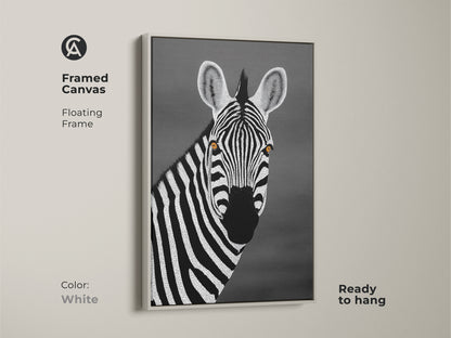 White framed canvas displaying a monochrome zebra. The floating frame highlights the minimalist dot artwork. This contemporary piece fits any room. Ideal African wildlife wall art for a modern home aesthetic.