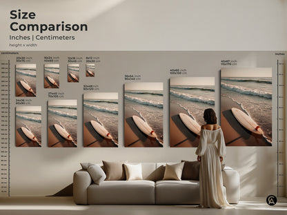 A size comparison shows surfboard artwork in inches and centimeters. Various sizes are displayed above a sofa for visual reference. Choose from different dimensions to suit your room. Find the perfect beach artwork for your space. Explore our range of canvas and poster prints.