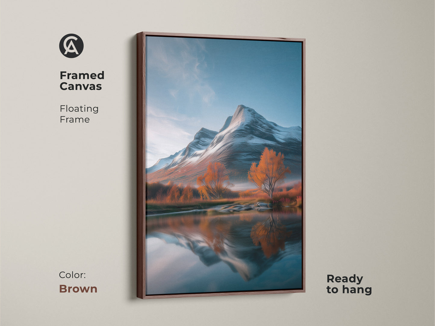Framed canvas artwork depicting a mountain landscape. This rustic nature inspired print with autumn trees is ready to hang. The floating frame adds elegance to this scenic view. The brown frame complements the blue white and orange artwork enhancing the reflection of the snowy mountains.