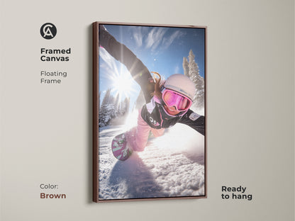 Framed canvas of a snowboarder in action. The brown floating frame enhances the artwork. This dynamic winter sports print is ready to hang. It is a perfect gift for winter sports enthusiasts.