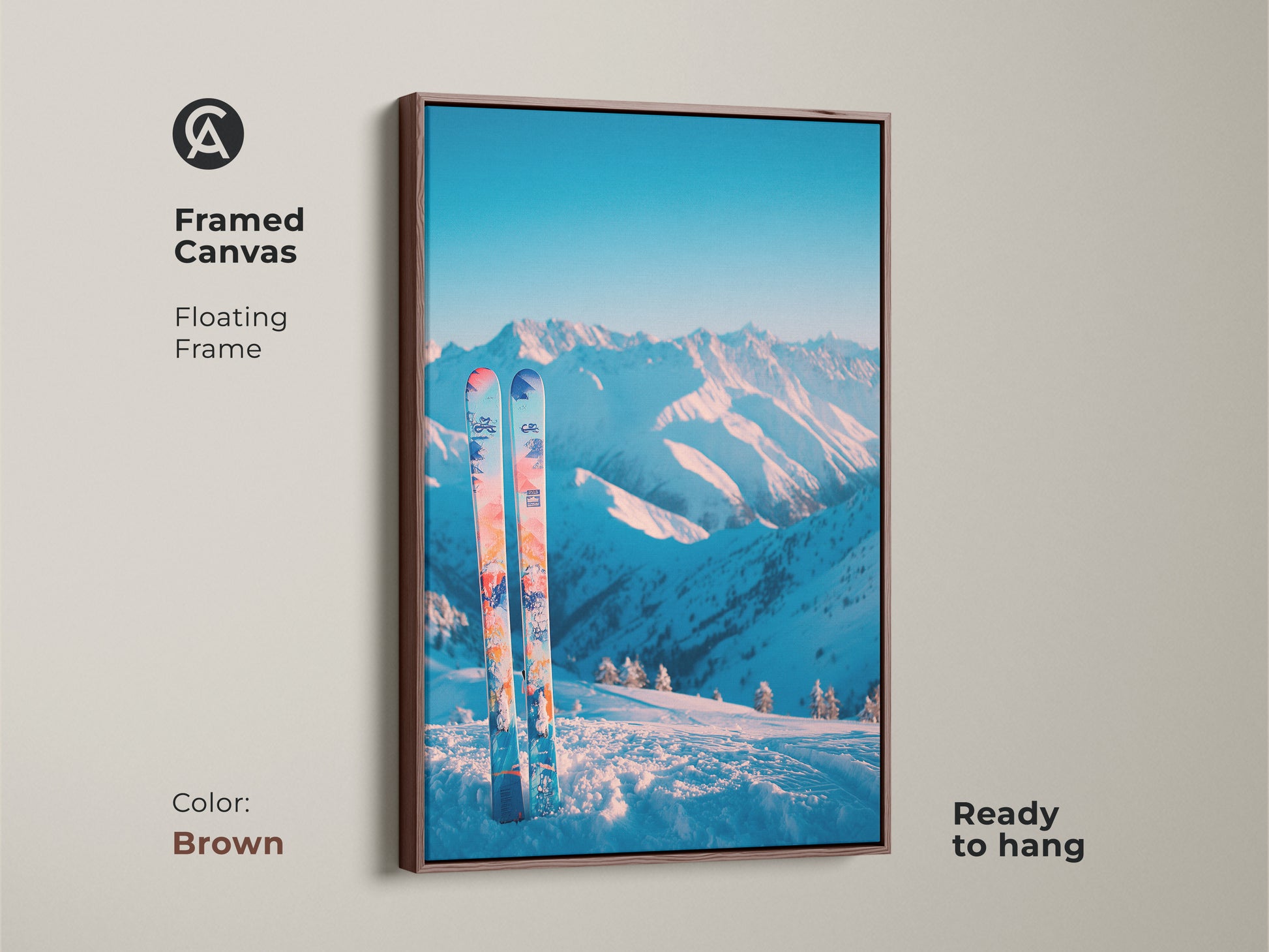 Brown framed canvas art print displaying a snowy mountain scene and skis. The floating frame enhances the artwork's visual appeal. This piece is ready to hang and adds a rustic touch to your decor. It's a great choice for nature-inspired interiors.