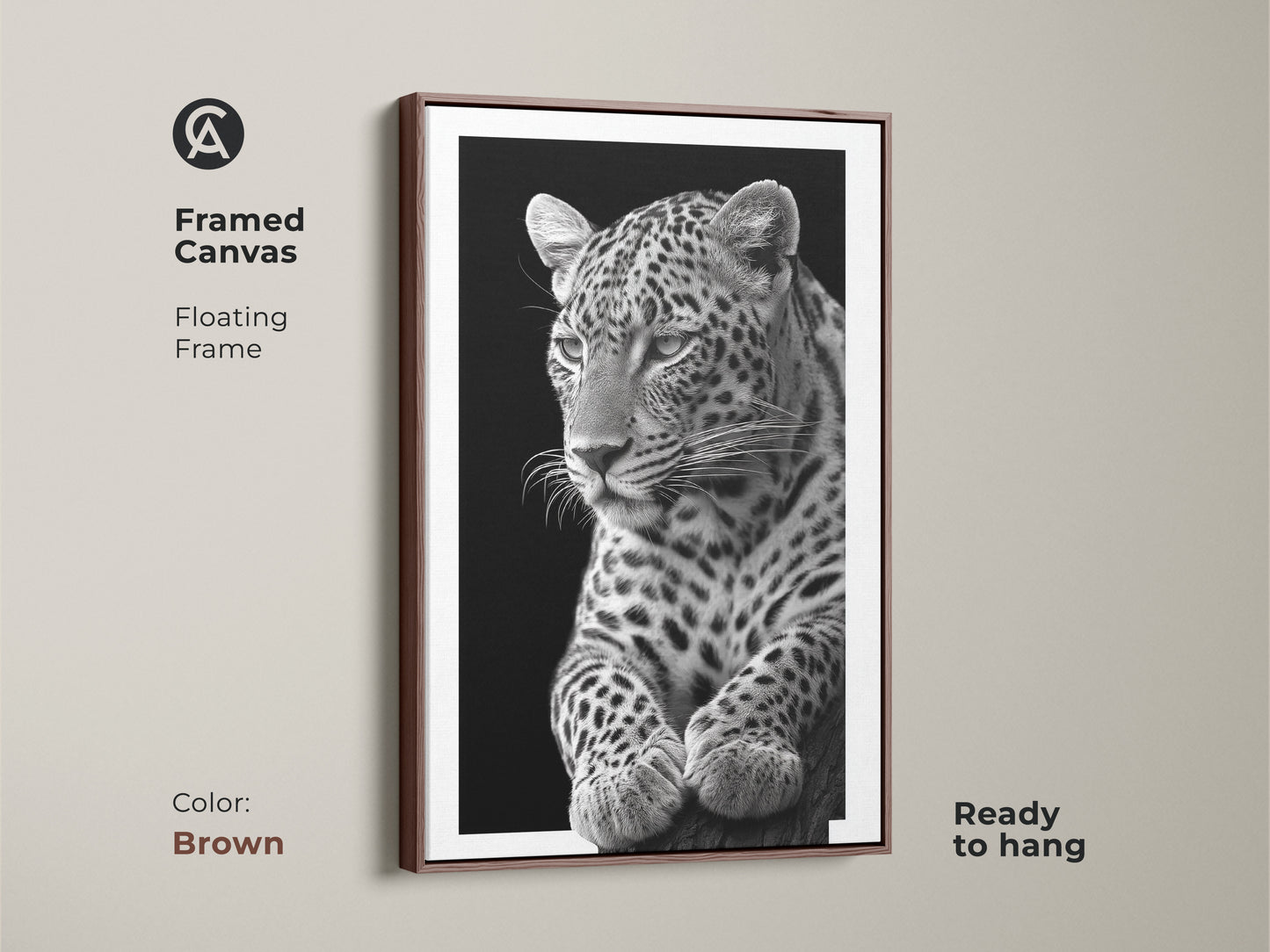 Framed in brown canvas art featuring a monochrome leopard. This floating frame enhances the realistic wildlife artwork. This wall decor is a unique home decor gift. Find your nature inspired wall art today!