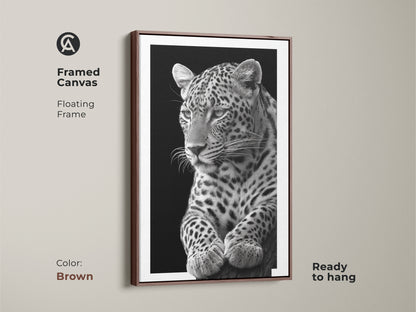Framed in brown canvas art featuring a monochrome leopard. This floating frame enhances the realistic wildlife artwork. This wall decor is a unique home decor gift. Find your nature inspired wall art today!