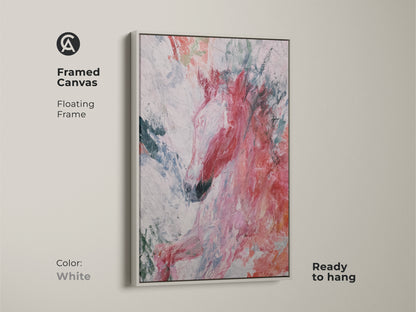Framed canvas print of an abstract horse artwork with a floating white frame. The expressive animal print is rich with coral and teal colors. This piece is ready to hang. It adds a touch of dynamic animal art to any space making it a great gift for equestrian enthusiasts and lovers of modern eclectic art.