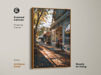 Framed canvas showing a photorealistic autumn street. Antique gold floating frame enhances the traditional artwork. Warm golden light creates a cozy atmosphere. Ready to hang for easy entryway decor. Perfect as a housewarming gift. This art is season-ready.