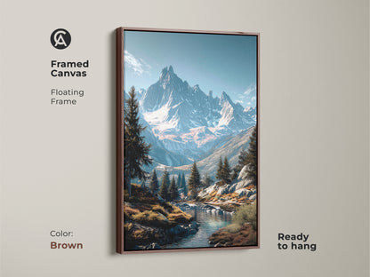 Brown framed canvas art print featuring a mountain river landscape. The floating frame adds a touch of elegance. Snow capped mountains are captured in this wall art. Evergreen trees line the river. Ready to hang. Shop framed art online.