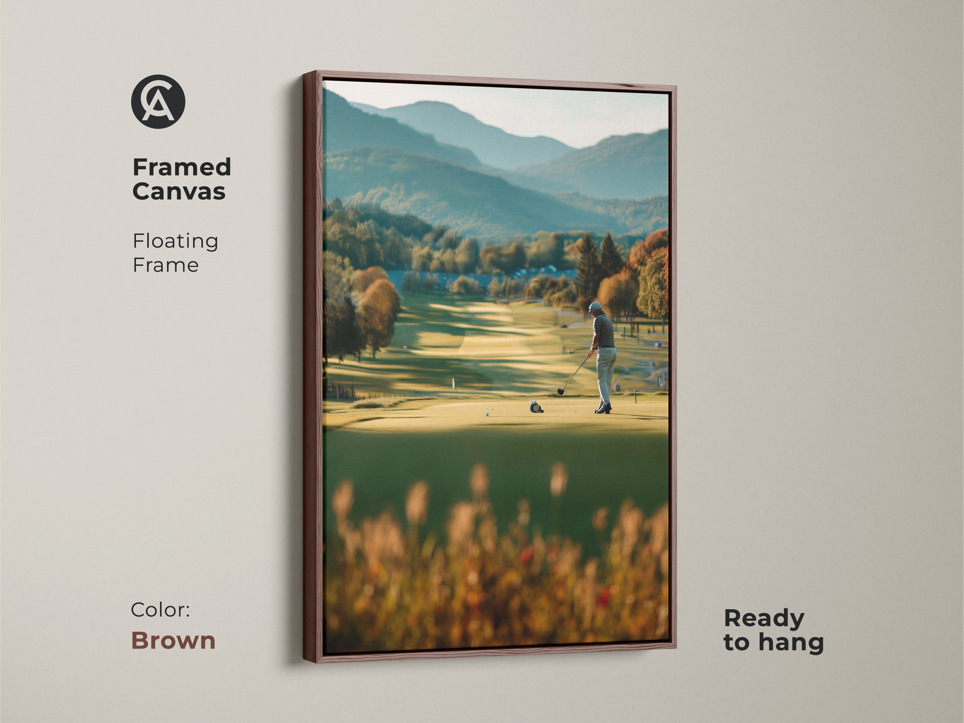 Elevate your home decor with this framed canvas golf artwork. This artwork portrays a golfer on a lush course with mountains in the distance. The brown floating frame complements the scene's natural tones. Ready to hang and admire.