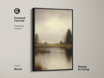 Framed canvas in black displays a rustic lake & trees print. The floating frame enhances the impressionistic style. The gray green nature artwork is ready to hang for residential wall art.