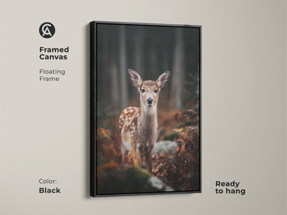 Framed canvas featuring a fawn in a forest. The black floating frame enhances this wildlife artwork. Ready to hang this rustic art suits any room. A great housewarming gift for nature enthusiasts.