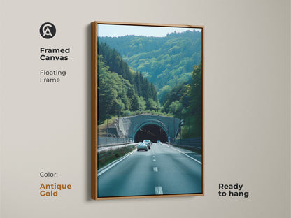 A framed canvas with an antique gold floating frame presents Green Forest Tunnel art. Ready to hang contemporary travel landscape. It showcases realistic car photography. Perfect travel destination canvas for car lovers. An automotive themed wall art and scenic nature print ideal for modern home art.