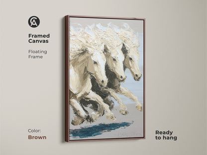 Framed canvas showcasing an impressionistic white horses print with a brown floating frame. This equestrian home decor is ready to hang and adds a touch of elegance to any room. The contemporary equine artwork features a neutral color palette. The brown frame complements the cream neutral wall art.