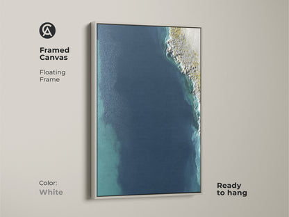 White Framed Canvas of Abstract Seascape. Floating frame enhances the deep blue shoreline. Ready to hang coastal minimalist wall art is perfect modern bedroom wall art. Add calm blue wall art to your living space.