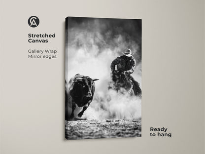Gallery wrapped Stretched Canvas art shows a cowboy riding a bull. This Western action scene print is monochrome. It is grayscale bull art for a man cave. A perfect piece of rustic Western decor ready to hang.