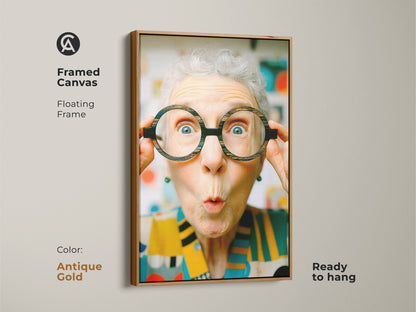Framed canvas art with a floating frame in antique gold. Features a woman with oversized glasses. This ready-to-hang piece adds a touch of humor and charm to your space.
