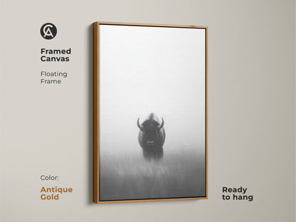 A framed monochrome bison canvas art with an antique gold floating frame. This ready to hang artwork features a minimalist wildlife print. This black and white animal art adds a rustic yet modern touch to your space. A unique gift for outdoor lovers.