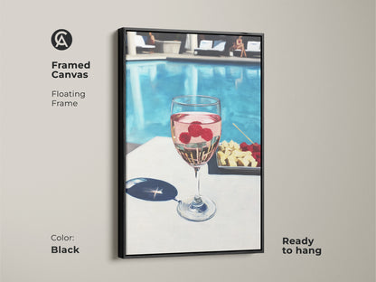 Framed canvas art in black showcasing a poolside wine and raspberry cocktail. Floating frame enhances the contemporary artwork. Ready to hang this piece adds sophistication to any dining or bar area. Modern wall art for wine enthusiasts.