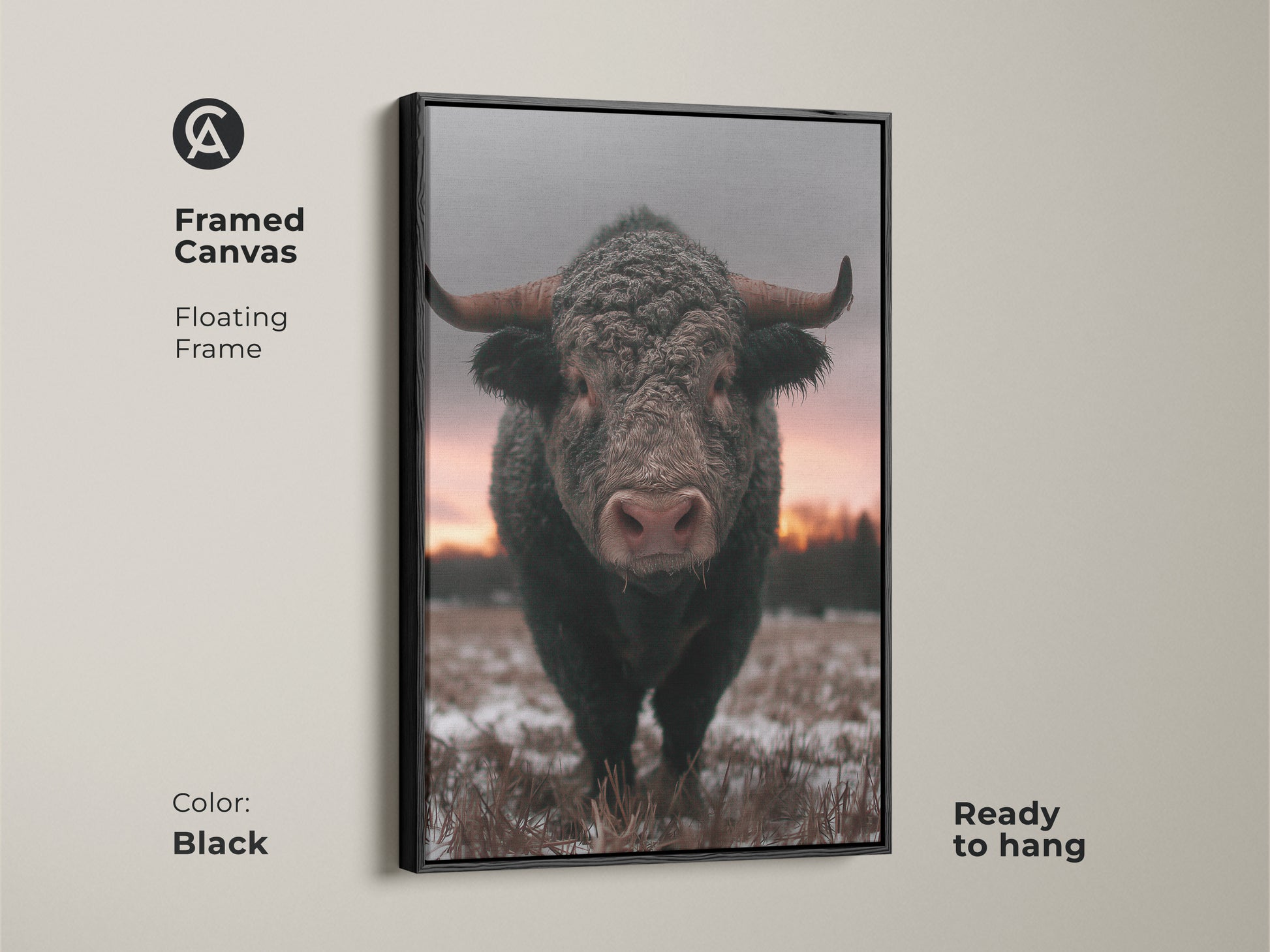 Framed canvas of a striking bull in a winter landscape. Black floating frame enhances this rustic farmhouse wall art. Ready to hang wildlife animal print for your living room. Brown gray pink art brings a cozy feel to any space. Ideal gift for him ranch.
