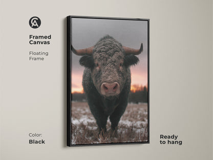 Framed canvas of a striking bull in a winter landscape. Black floating frame enhances this rustic farmhouse wall art. Ready to hang wildlife animal print for your living room. Brown gray pink art brings a cozy feel to any space. Ideal gift for him ranch.