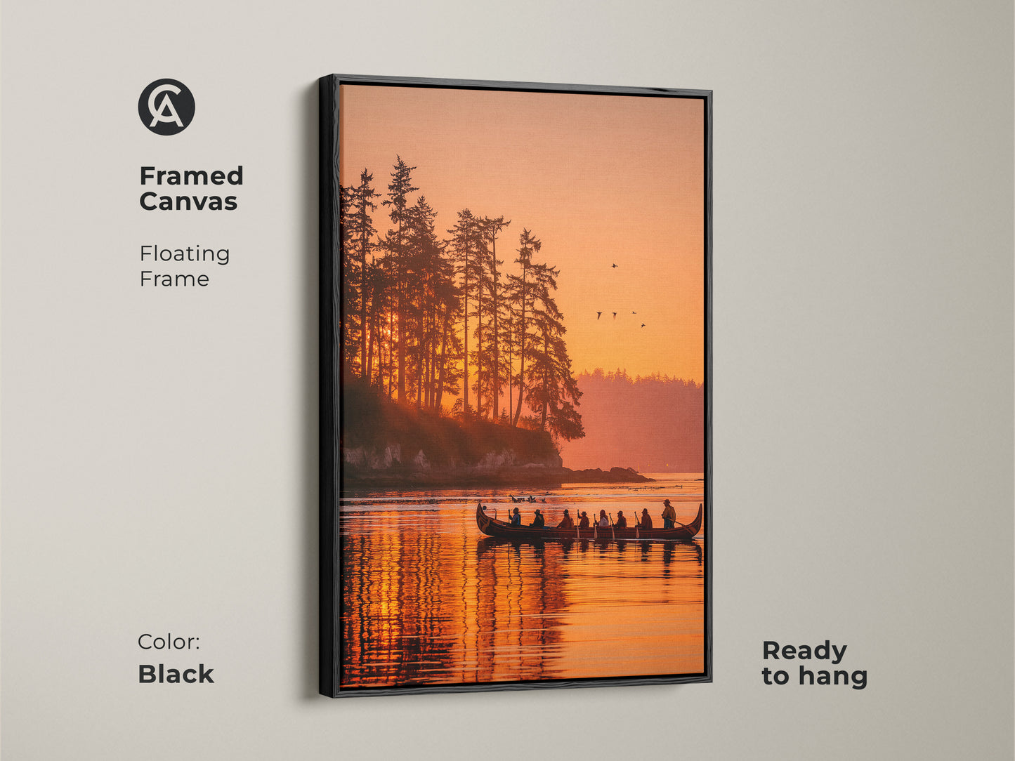 Framed canvas art with a floating frame showcasing a picturesque sunset over a lake. A canoe carrying silhouetted figures adds a touch of adventure to the scene. The black frame enhances the artwork. This canvas comes ready to hang adding convenience to your home decor. Shop framed art now.