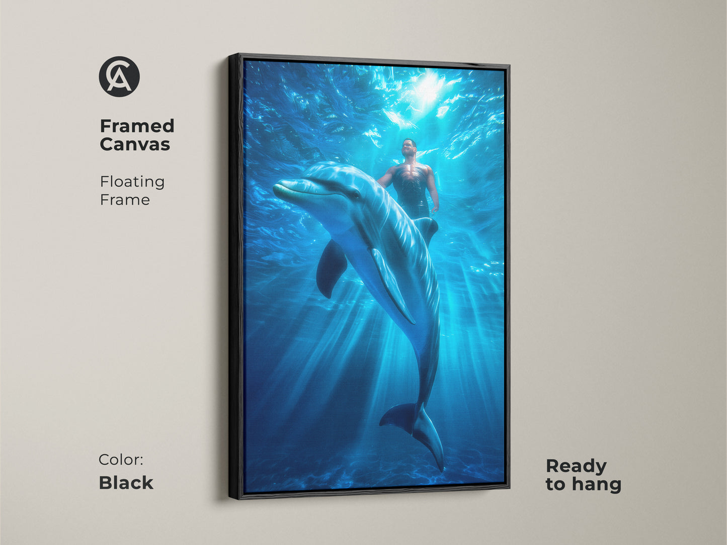 Framed canvas art of a man swimming with a dolphin underwater. The floating frame enhances this contemporary bedroom decor. The black frame is ready to hang bringing a touch of surrealism to your coastal living room.