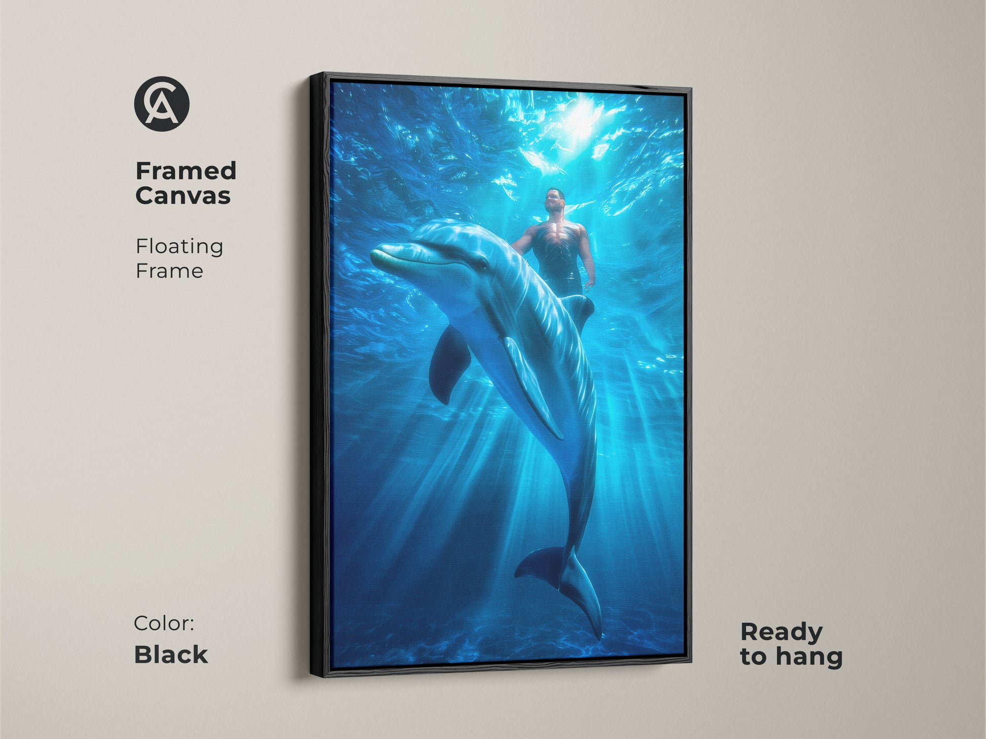 Framed canvas art of a man swimming with a dolphin underwater. The floating frame enhances this contemporary bedroom decor. The black frame is ready to hang bringing a touch of surrealism to your coastal living room.