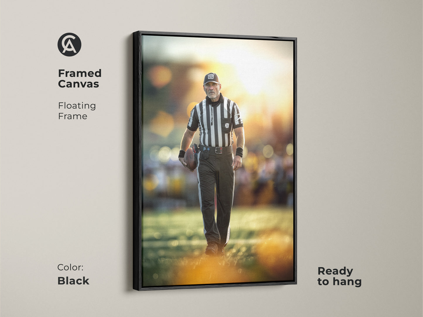 Framed canvas of a football referee. The floating frame is black. This ready to hang artwork suits a man cave. It's sports action photography perfect for an office wall art print.