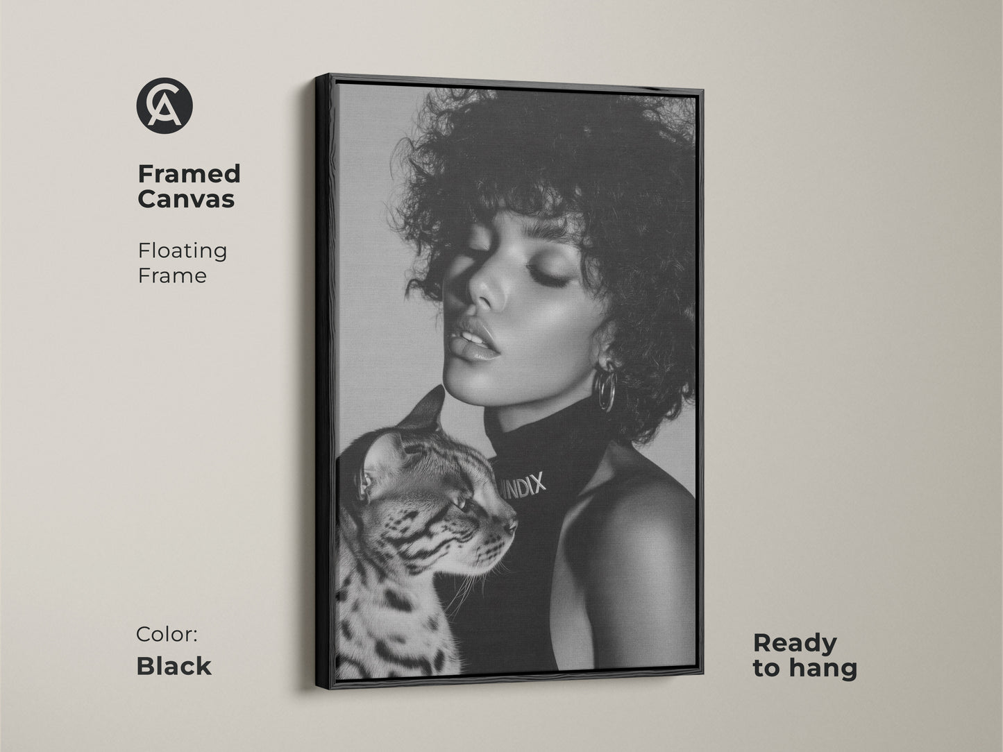 Black framed canvas art featuring a monochrome portrait of a woman with a Bengal cat. This floating frame adds a contemporary touch. Ready to hang this piece enhances any room. Perfect for modern home decor.