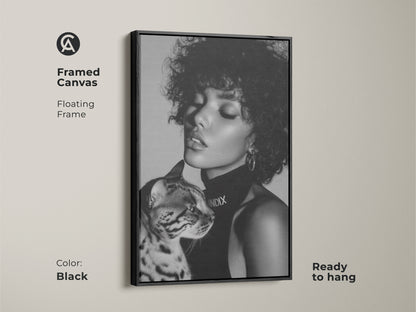 Black framed canvas art featuring a monochrome portrait of a woman with a Bengal cat. This floating frame adds a contemporary touch. Ready to hang this piece enhances any room. Perfect for modern home decor.