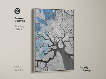 Abstract artwork with a white floating frame showcasing an oak tree. The modern canvas print features a blue sky blending nature and art. Ready to hang this artwork is ideal for any room. It's a great housewarming gift adding an elegant touch. The tree art complements any decor.