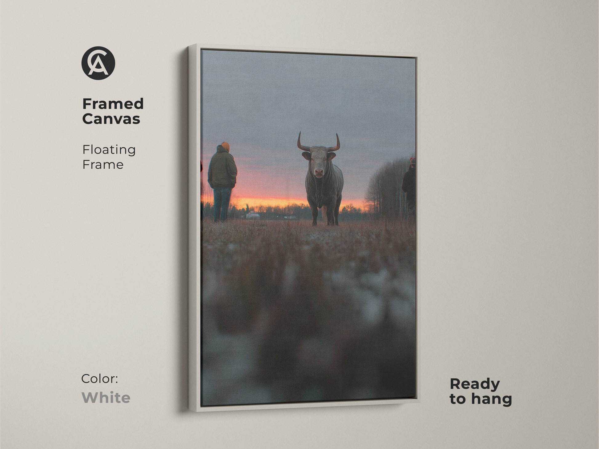 Framed canvas artwork of a bull at sunset with a floating white frame. This ready-to-hang piece is ideal for farmhouse wall decor. The rustic animal art enhances any bedroom. This orange red gray art is a perfect gift for farm lovers. The white frame adds a modern touch