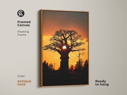 Framed canvas featuring a silhouetted baobab tree. Antique gold floating frame adds elegance to this landscape wall art. Ready to hang and perfect as eclectic home decor. This orange yellow nature print brings the savanna sunset to your walls. A unique wall hanging art.