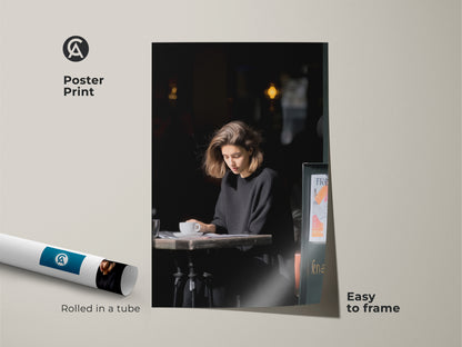 Poster print of a woman enjoying coffee at a cafe. A minimalist black and white art piece. Easy to frame wall art. Sophisticated home accent for coffee enthusiasts.
