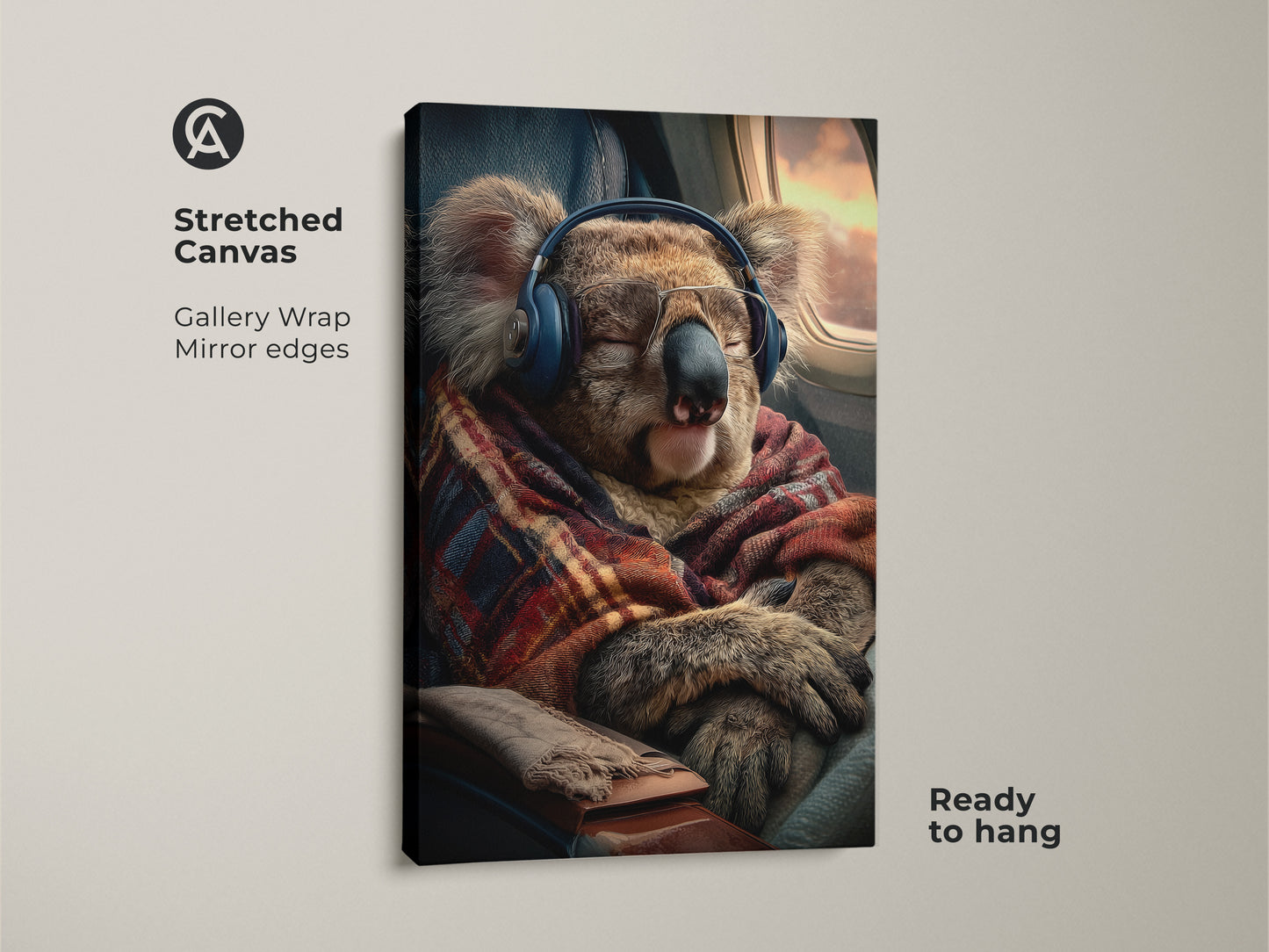 Gallery wrapped canvas featuring a koala on a plane is ready to hang. The animal wears headphones and has a blanket. This unique koala artwork is a perfect gift for travel enthusiasts. It will bring cozy animal vibes to your bedroom or office. Get yours today