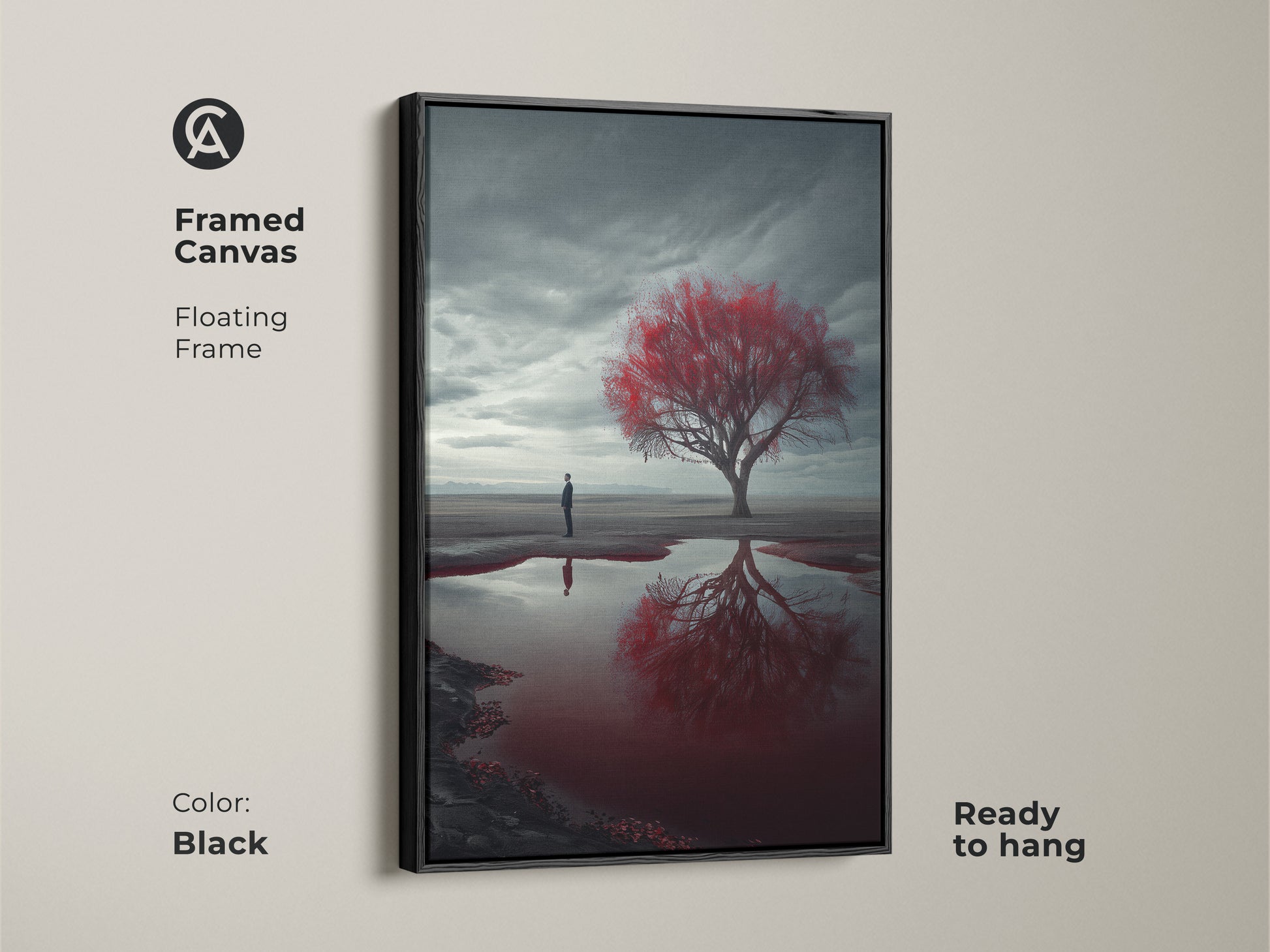 Framed canvas art featuring a surreal desert landscape with a vibrant red tree. The floating frame in black enhances the moody contemporary art. Ready to hang this piece blends nature and human introspection. It is a perfect addition to living rooms or bedrooms.