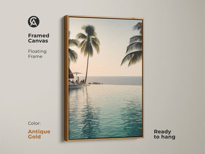 This framed canvas features an infinity pool with palm trees. A floating frame in antique gold makes it ready to hang. Enjoy a coastal ocean view with this tropical beach landscape artwork.