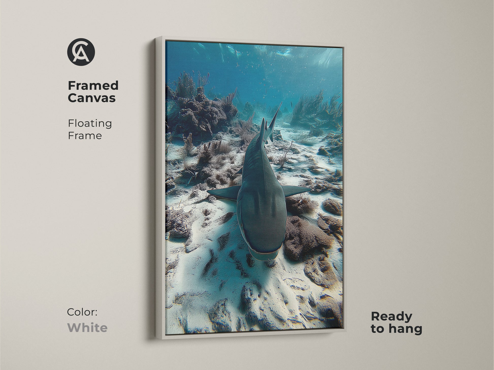 Framed canvas with white floating frame showcasing a shark swimming above a coral reef. This photorealistic ocean print is ready to hang. The white frame enhances the deep blue and teal tones of the underwater artwork. Perfect for coastal home decor or as a unique housewarming gift.