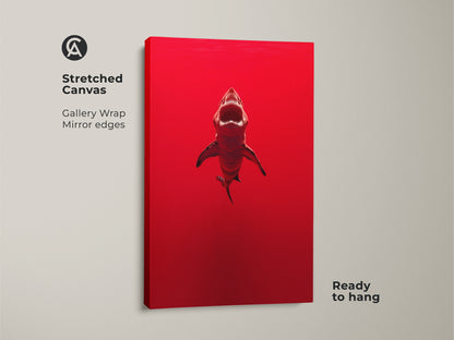 Stretched crimson shark canvas art ready to hang. Gallery wrapped with mirrored edges. The minimalist artwork showcases a powerful ocean predator in a striking red color. This ocean predator artwork is a great shark themed home decor for man caves and offices. It's a unique gift for shark lovers.