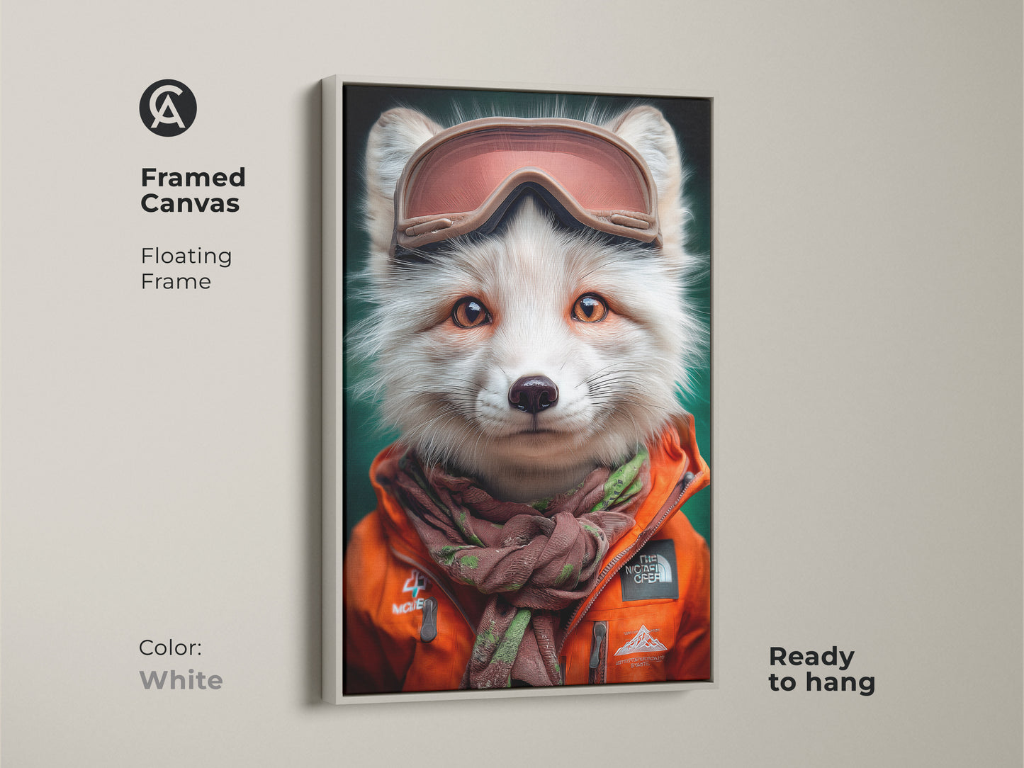 White framed canvas artwork print of a fox in ski goggles and an orange jacket. Winter wildlife animal art ready to hang. Features an eclectic style and a cute fox portrait. Perfect for adding a unique touch to your home. Makes a great gift for animal enthusiasts.